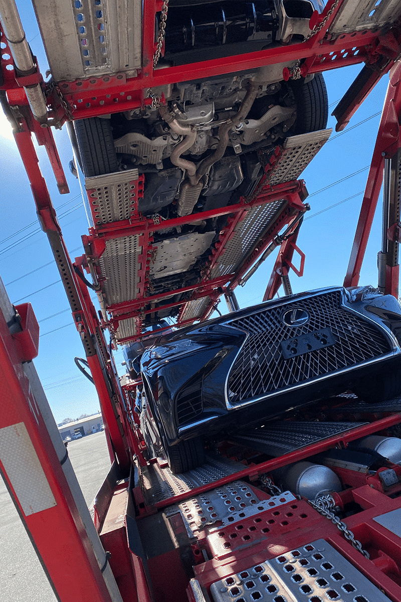 bottom rack of car carrier trailer looking up