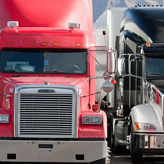 https://adcocktransport.com/wp-content/uploads/2024/02/Freight-Division-Two-Trucks_575.jpg